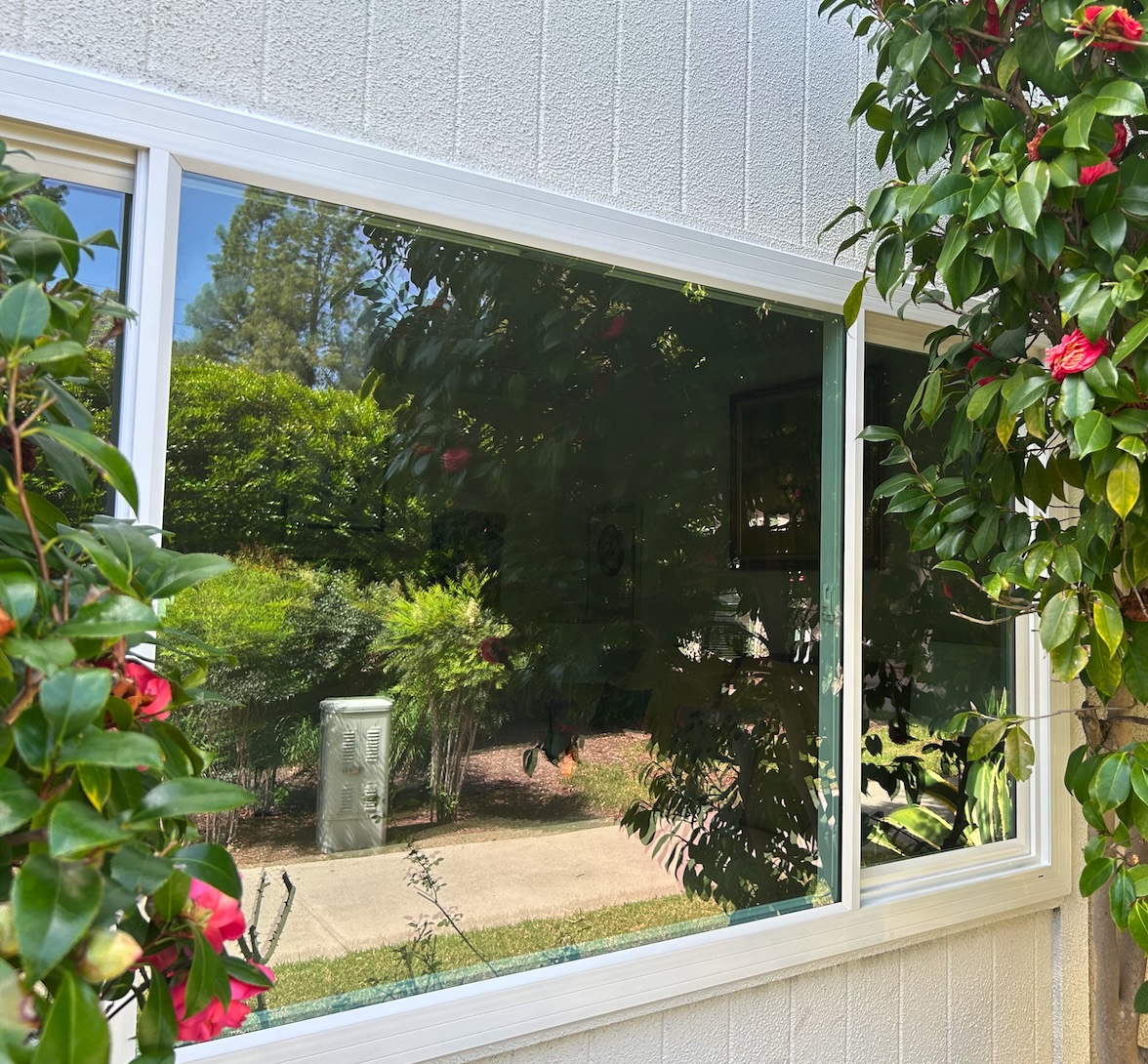 White vinyl retrofit window slider in a Laguna Woods Village bedroom